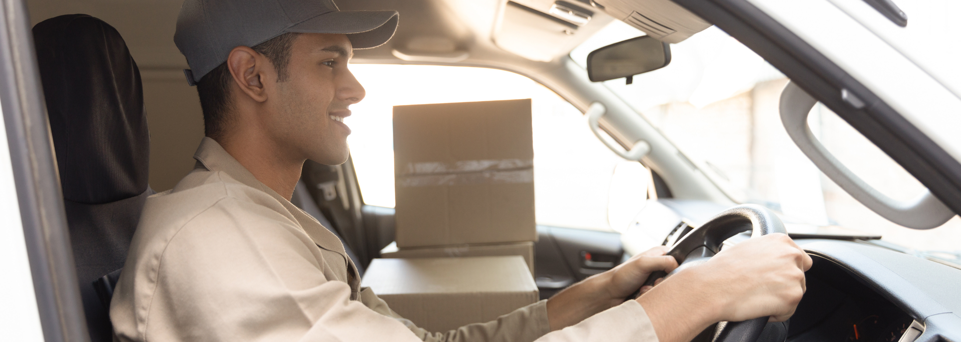 Picture of someone looking happy driving a van. Picture of someone looking happy driving a van.