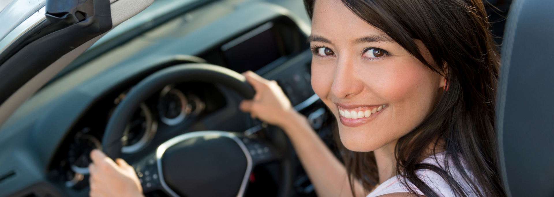 Someone happily driving a car Someone happily driving a car
