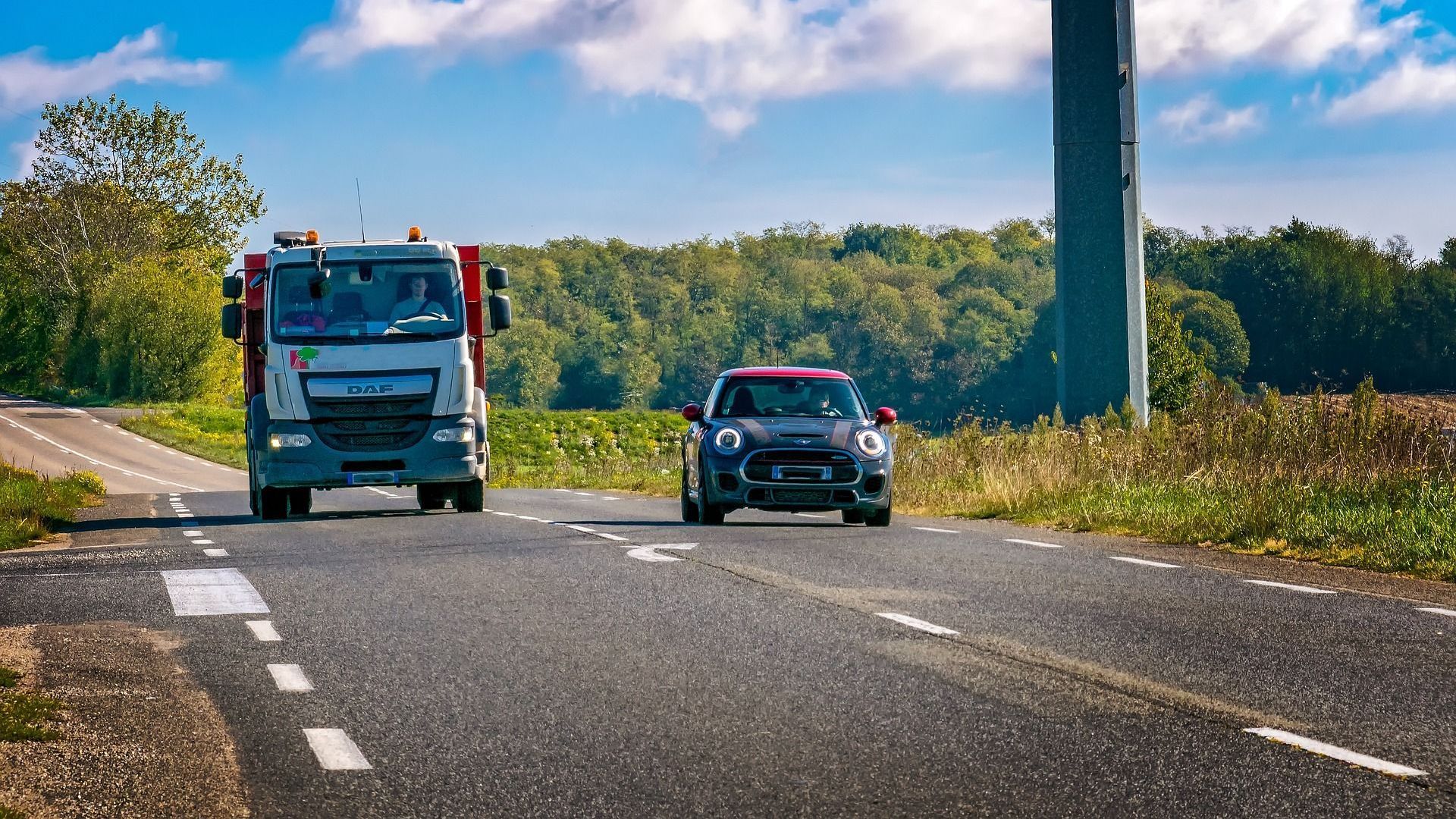 Picture of a car overtaking a truck Picture of a car overtaking a truck