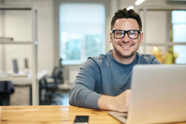 Gentleman using his computer.