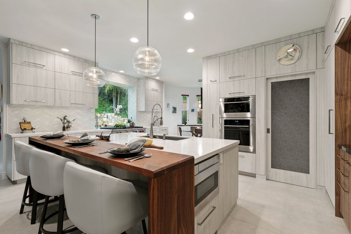 There is a large island in the middle of the kitchen.