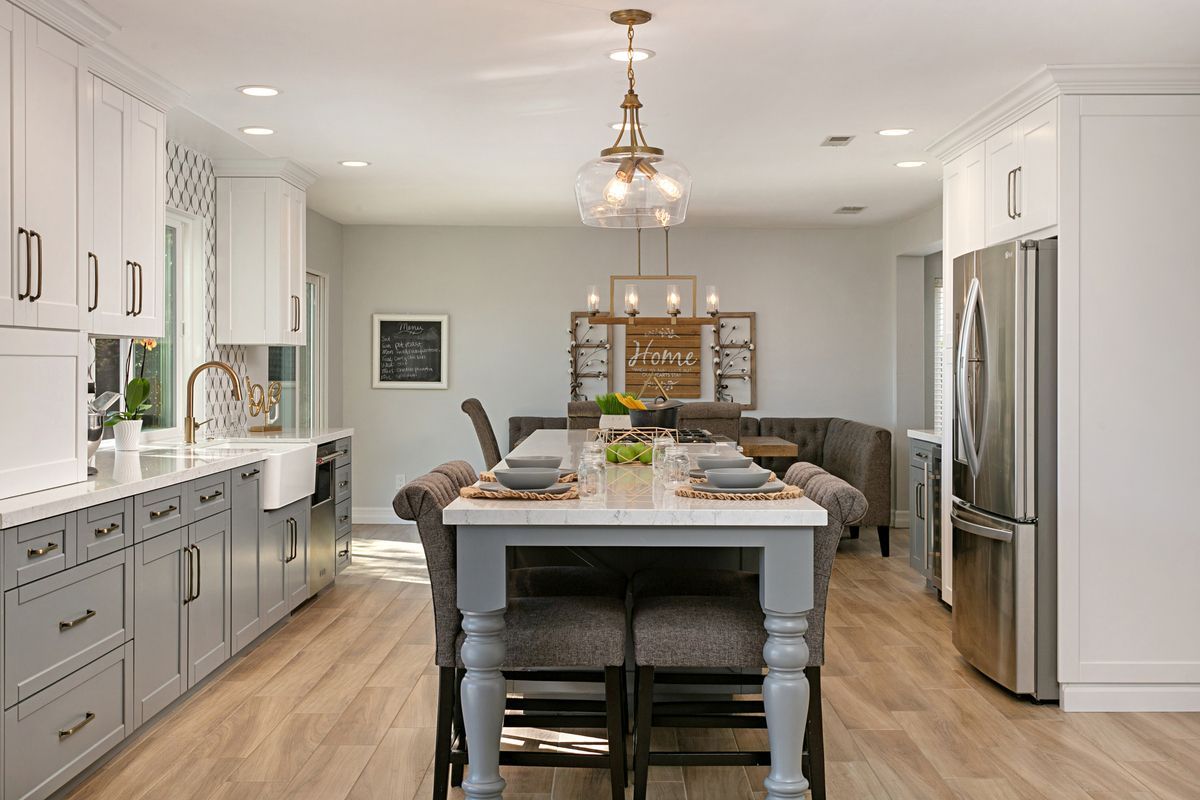 There is a large island in the middle of the kitchen.