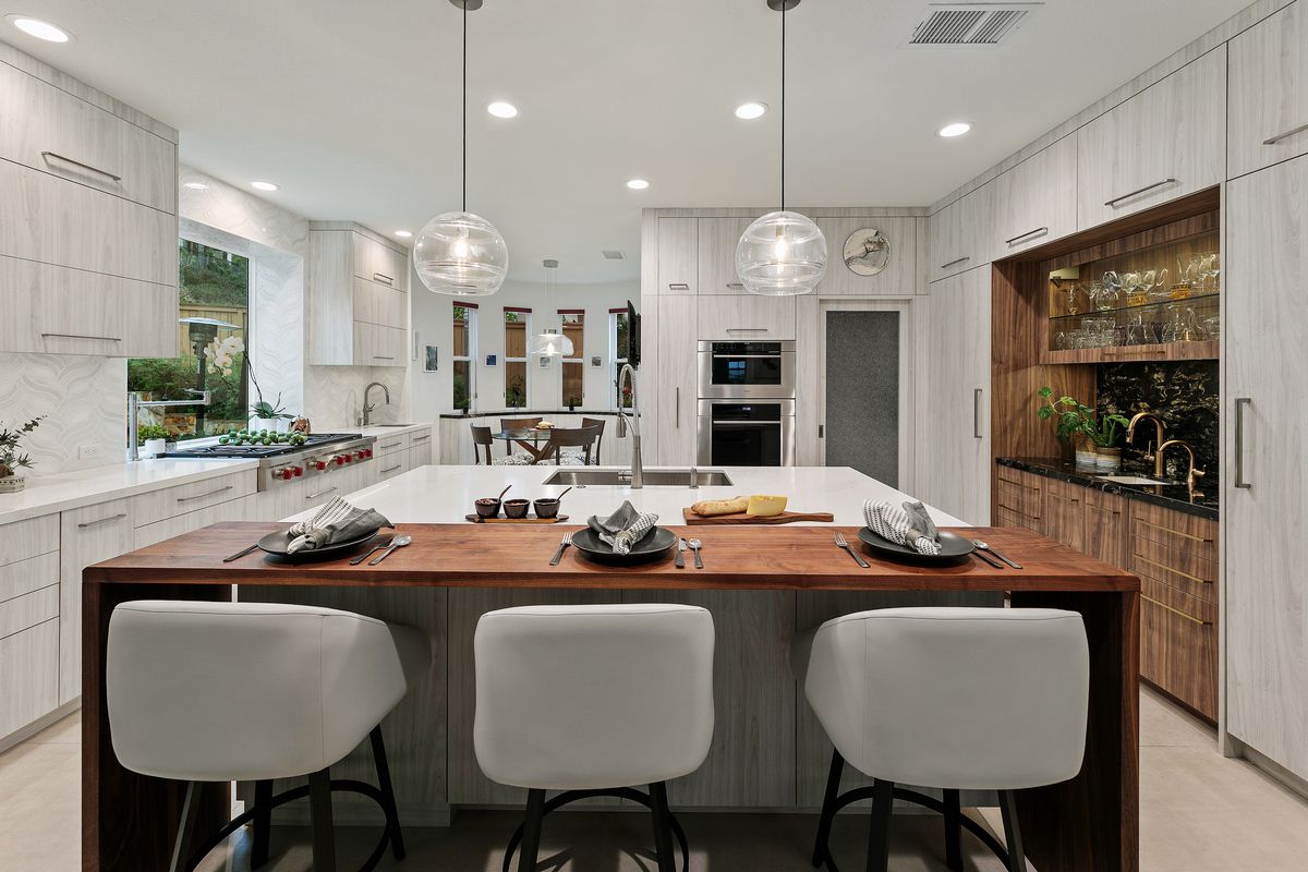 There is a large island in the middle of the kitchen.