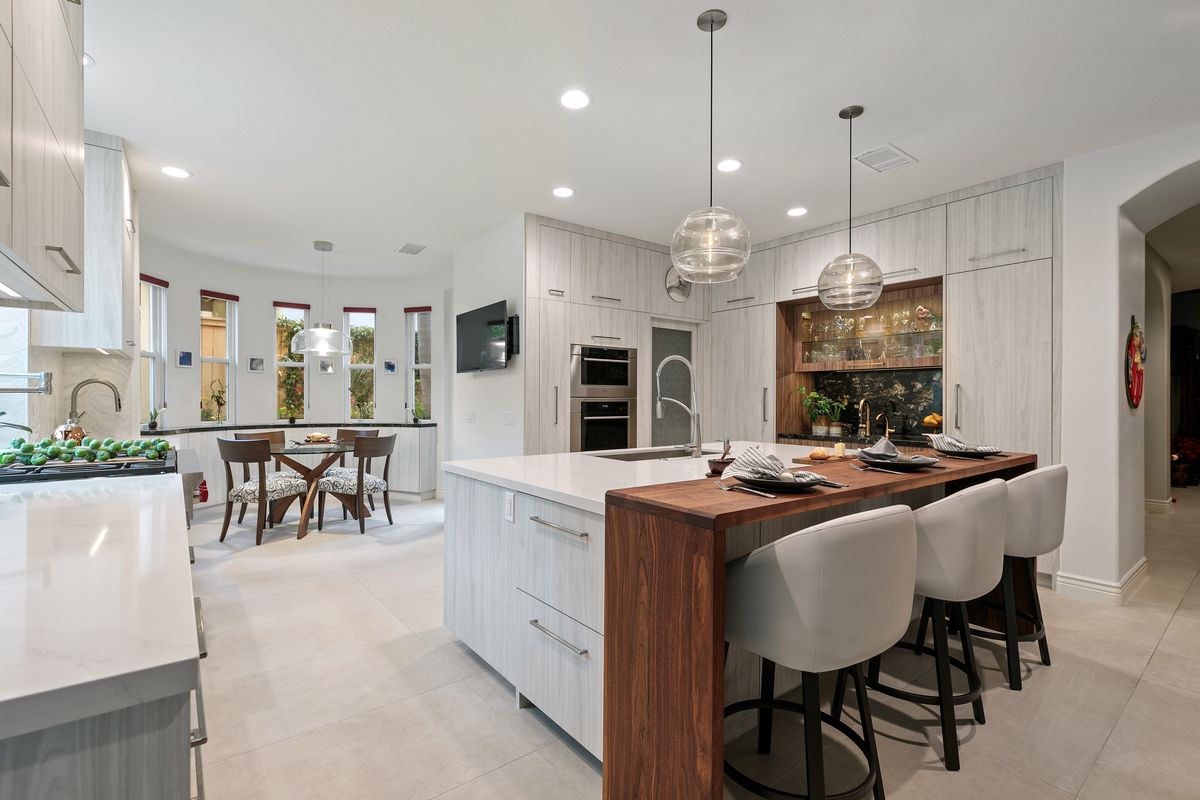 There is a large island in the middle of the kitchen.