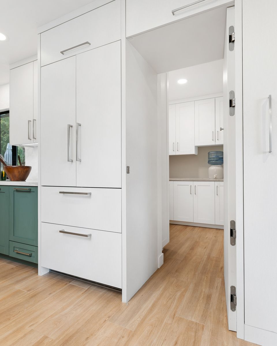 There is a large island in the middle of the kitchen.