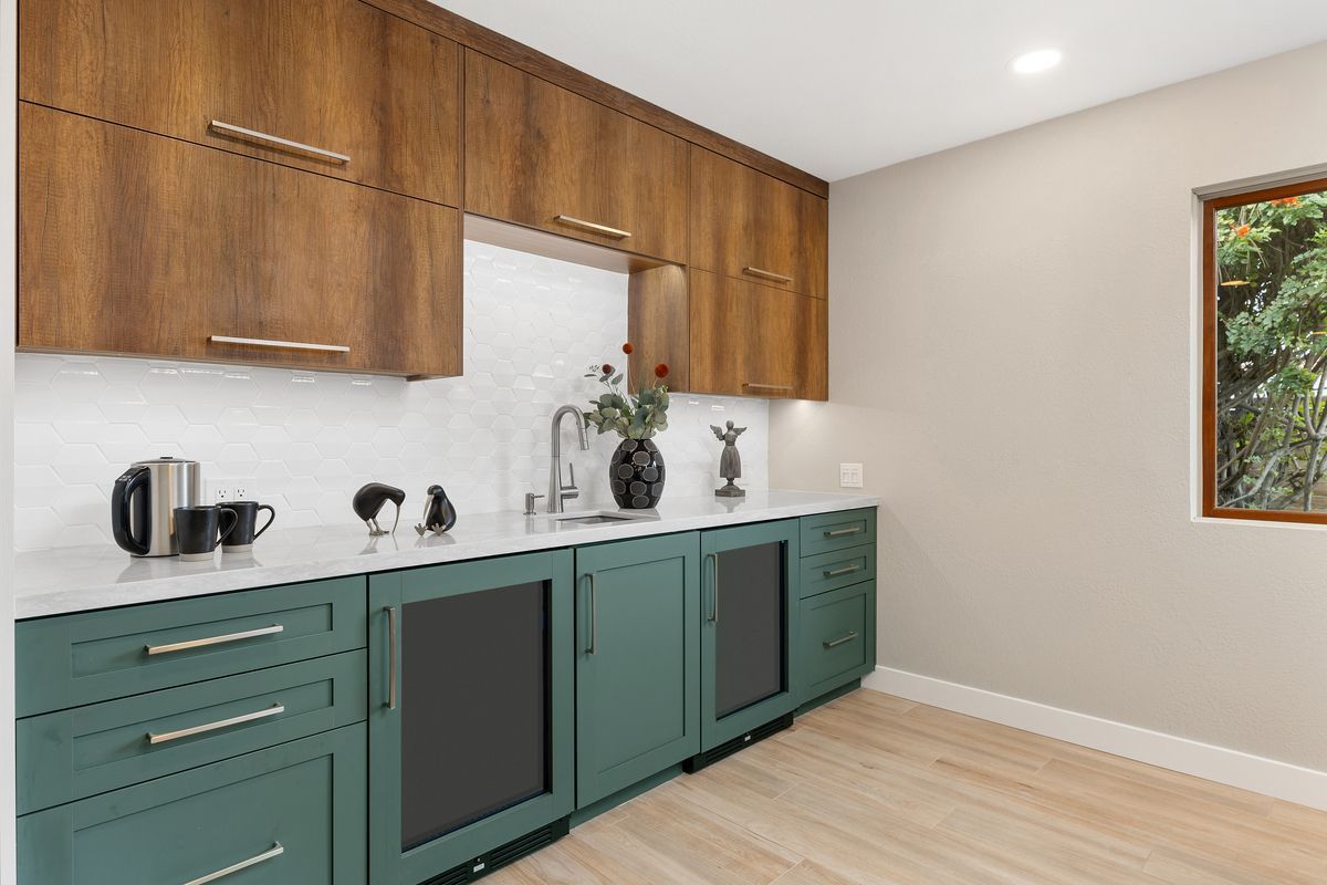 There is a large island in the middle of the kitchen.