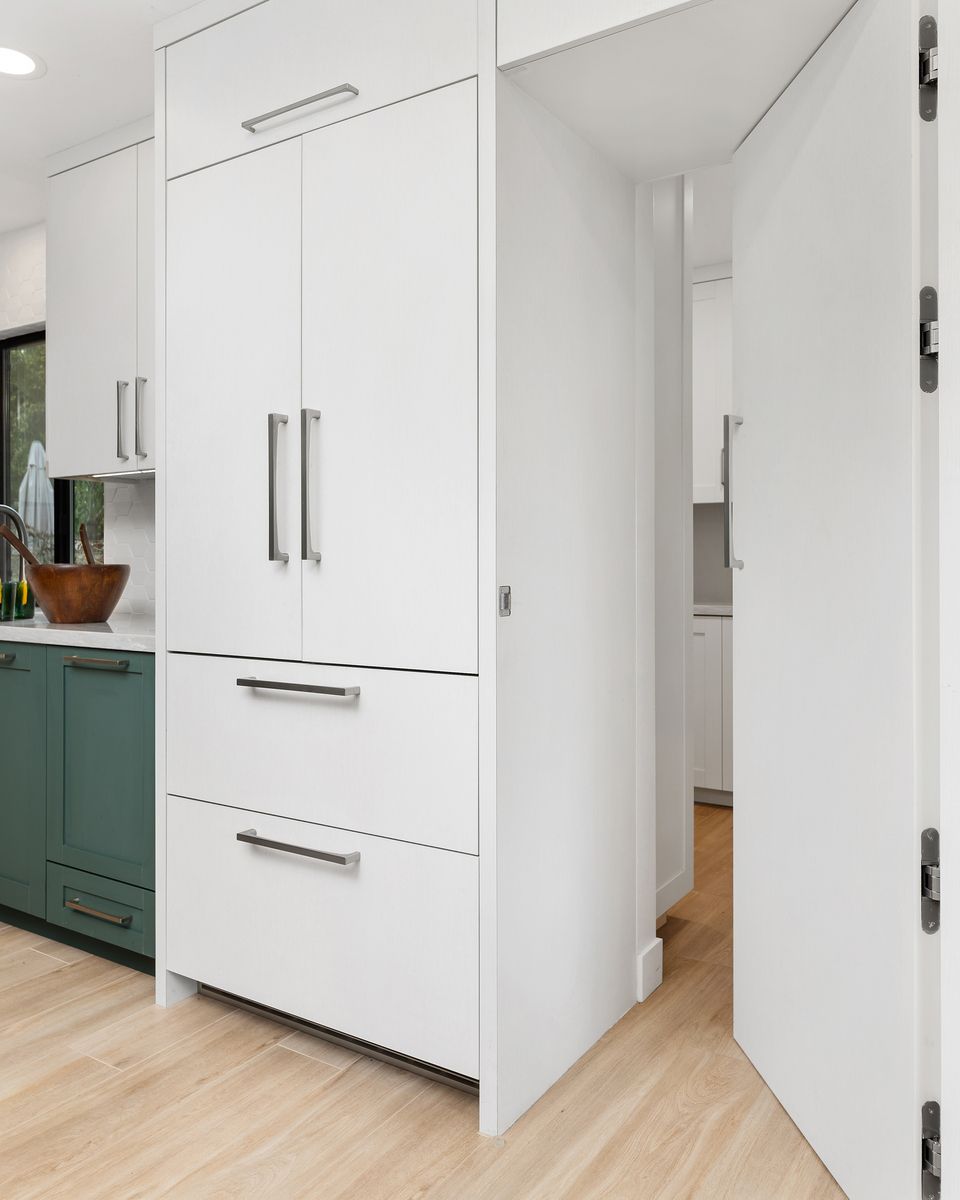 There is a large island in the middle of the kitchen.