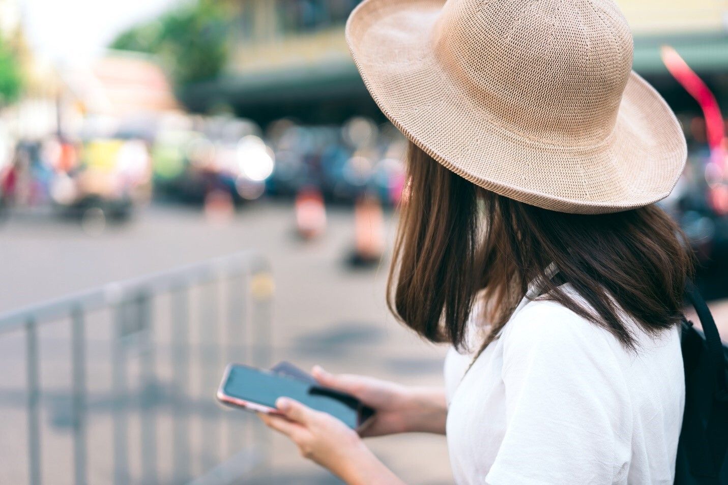 Woman on the Street Holding a Phone