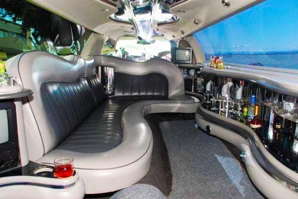 inside a limousine with a row of beverages
