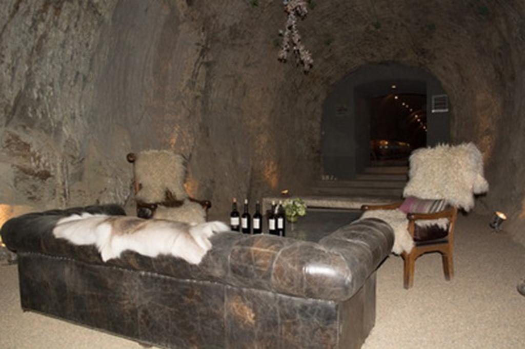 wine cave with a couch and chairs