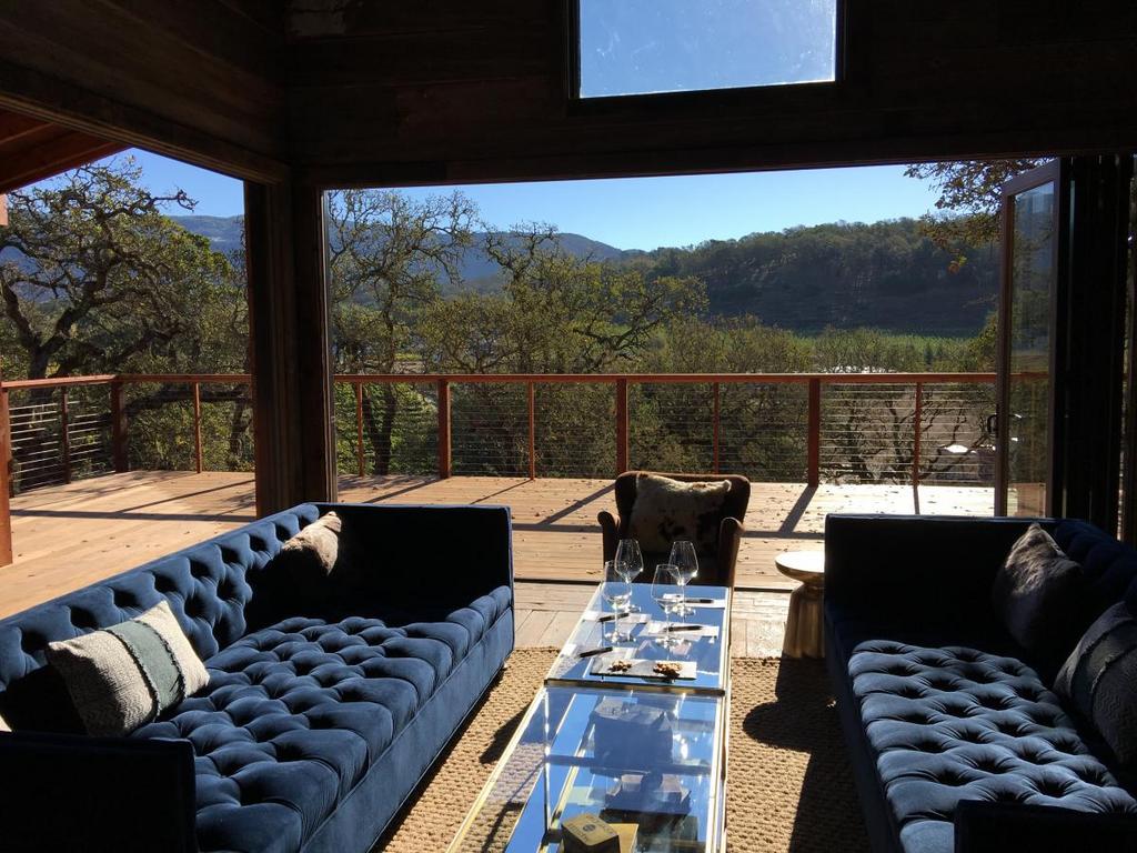 outdoor seating area with long couches on each side