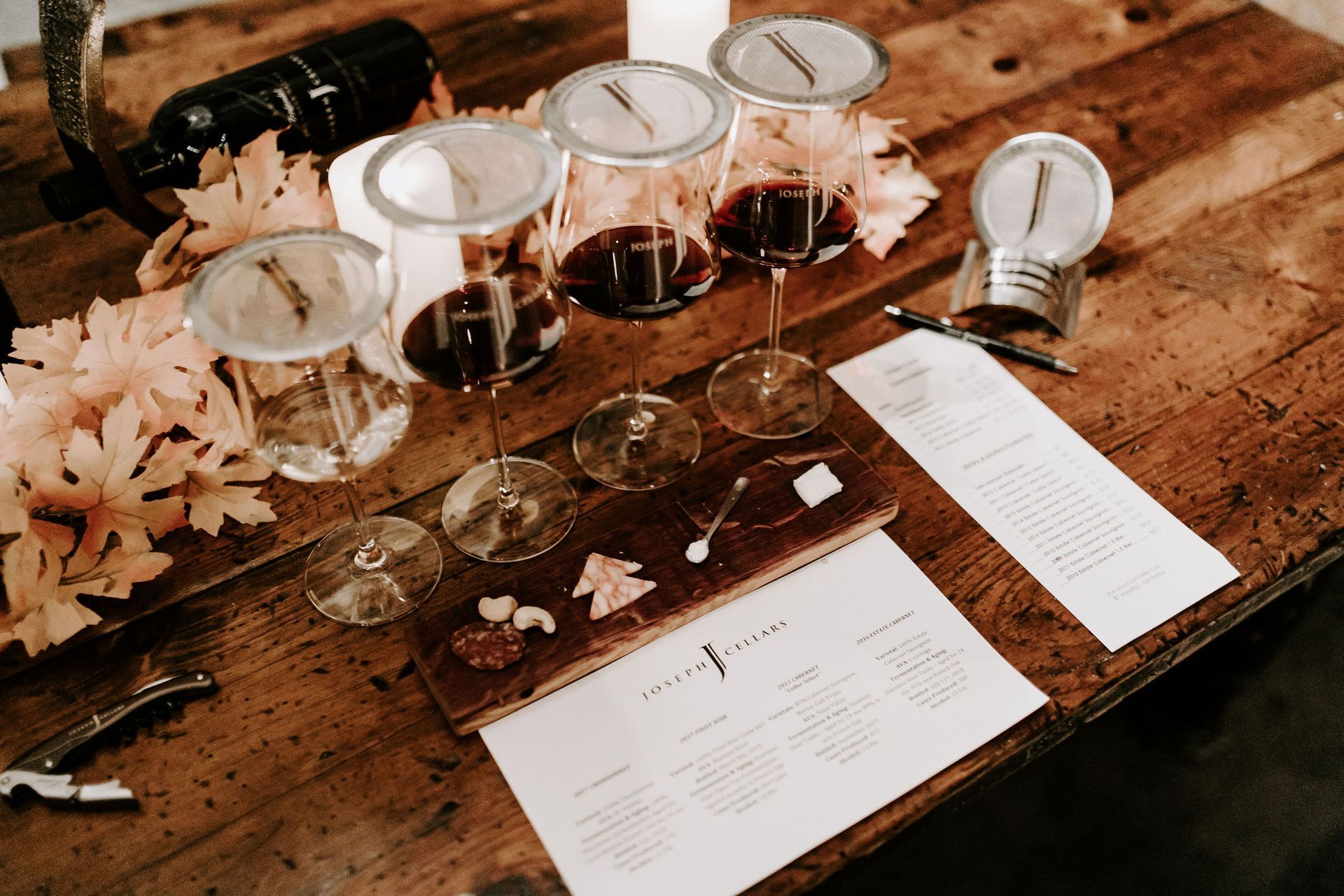 wine glasses with flowers near them