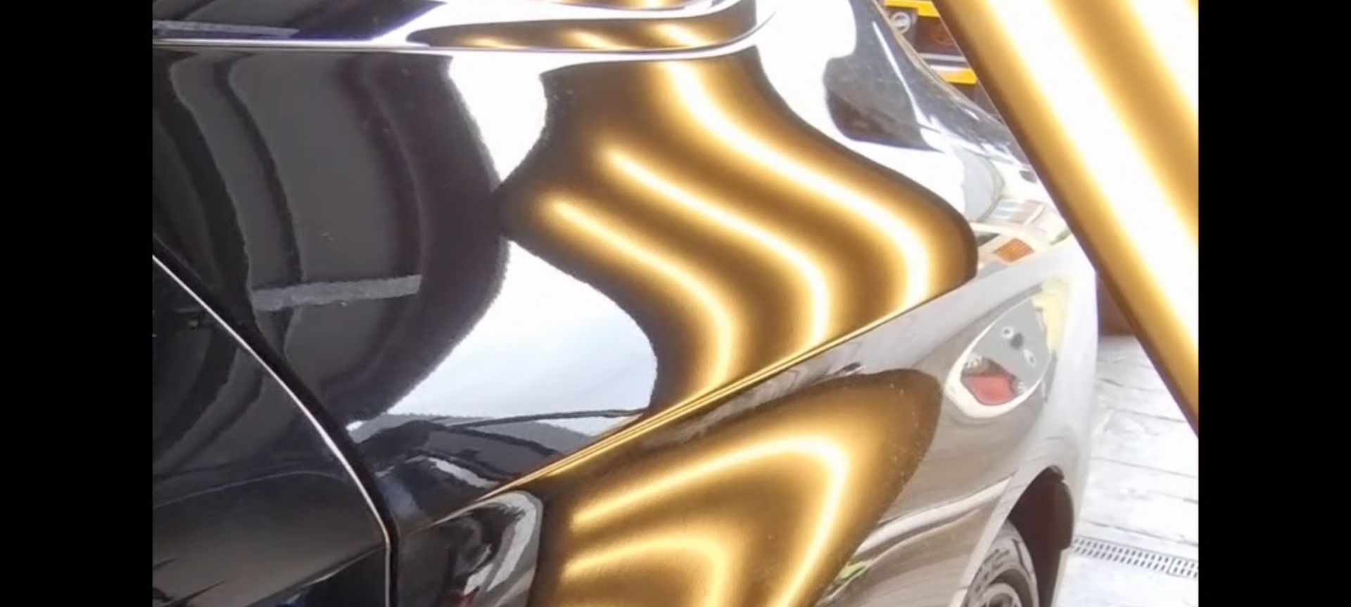 a black car with dents
