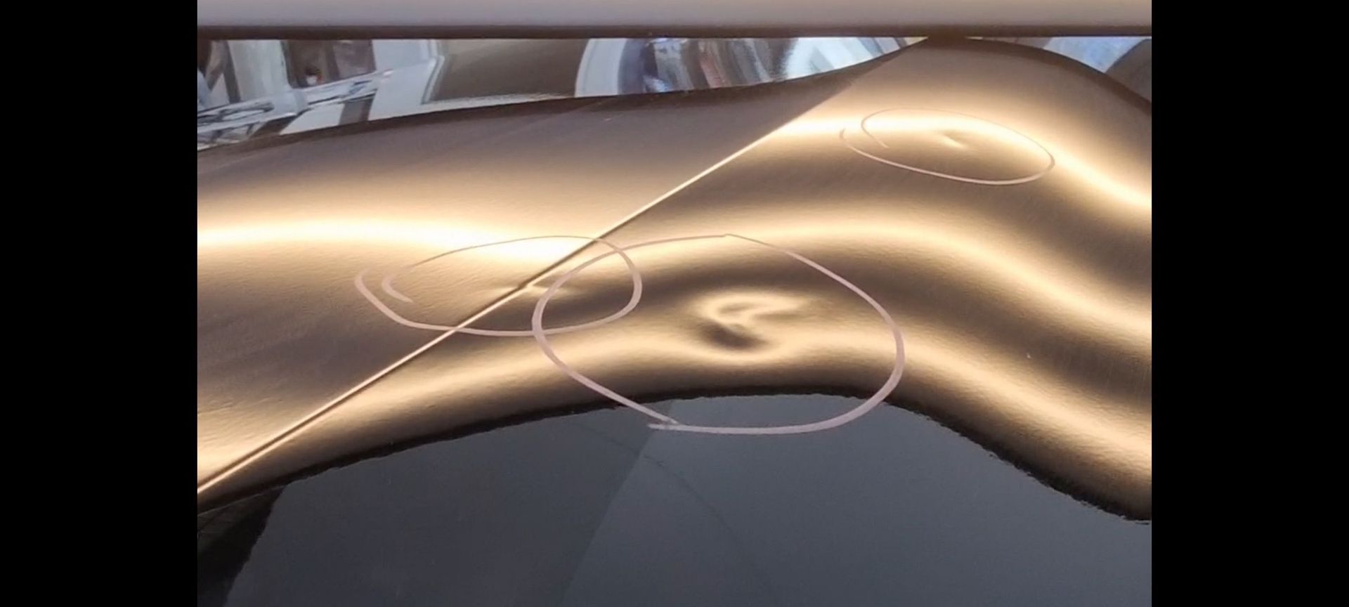 a close up of a car dents to be fixed by Xquisite PDR