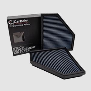Two air filters are sitting next to each other on a white surface.