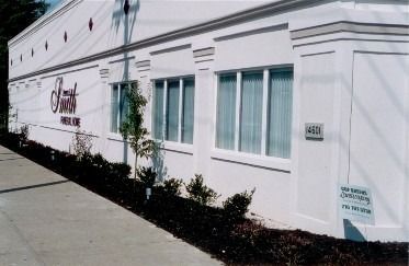 A white building with the sign 