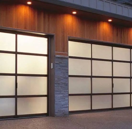 There Are Two Garage Doors on The Side of A Building — Illawarra Garage Doors in Albion Park Rail, NSW