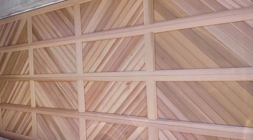 A Wooden Wall with A Geometric Pattern on It — Illawarra Garage Doors in Albion Park, NSW