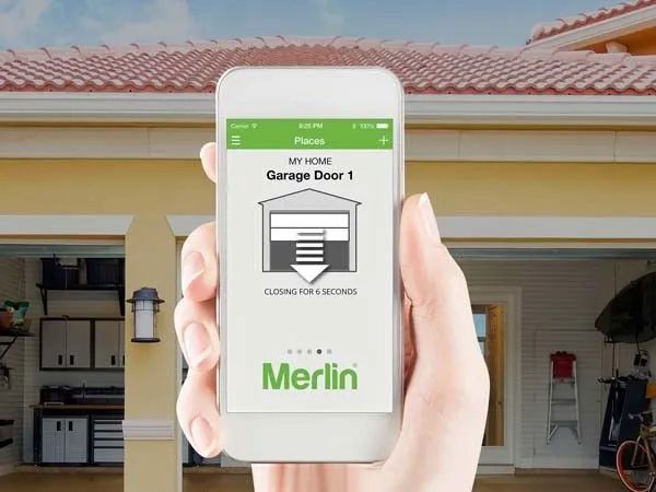 A Car Is Parked in Front of A Garage Door — Illawarra Garage Doors in Albion Park Rail, NSW