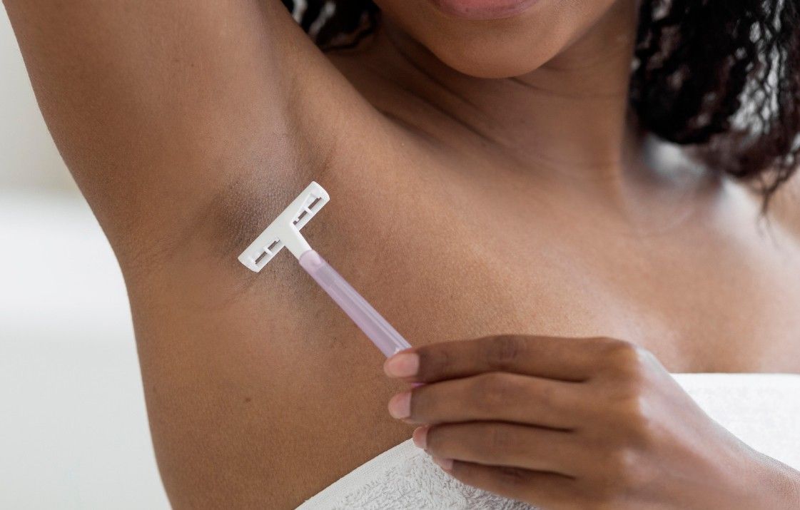 Laser Hair Removal Coventry dark skinned woman shaving before laser hair removal