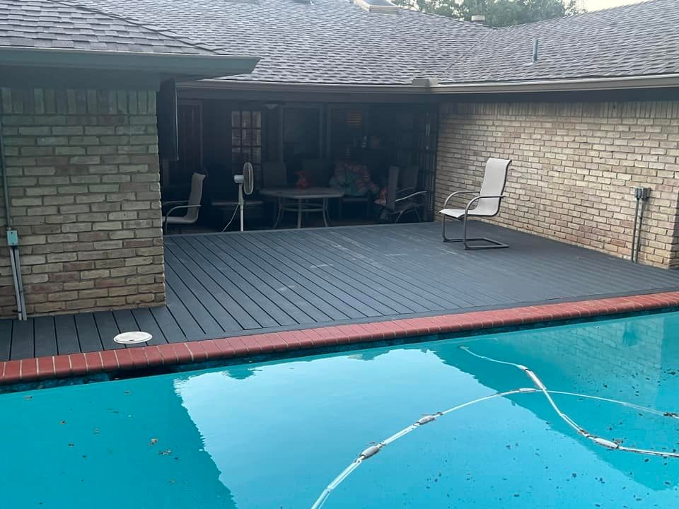 Backyard pool with turquoise water, brick walls, and a covered patio with chairs