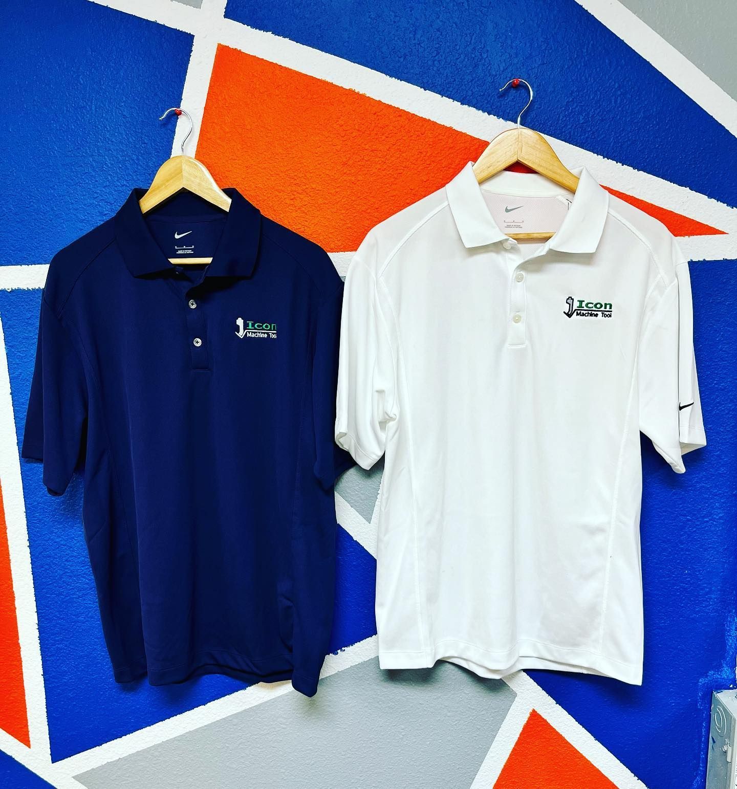 Two shirts and a mug with the h & b electric logo on them