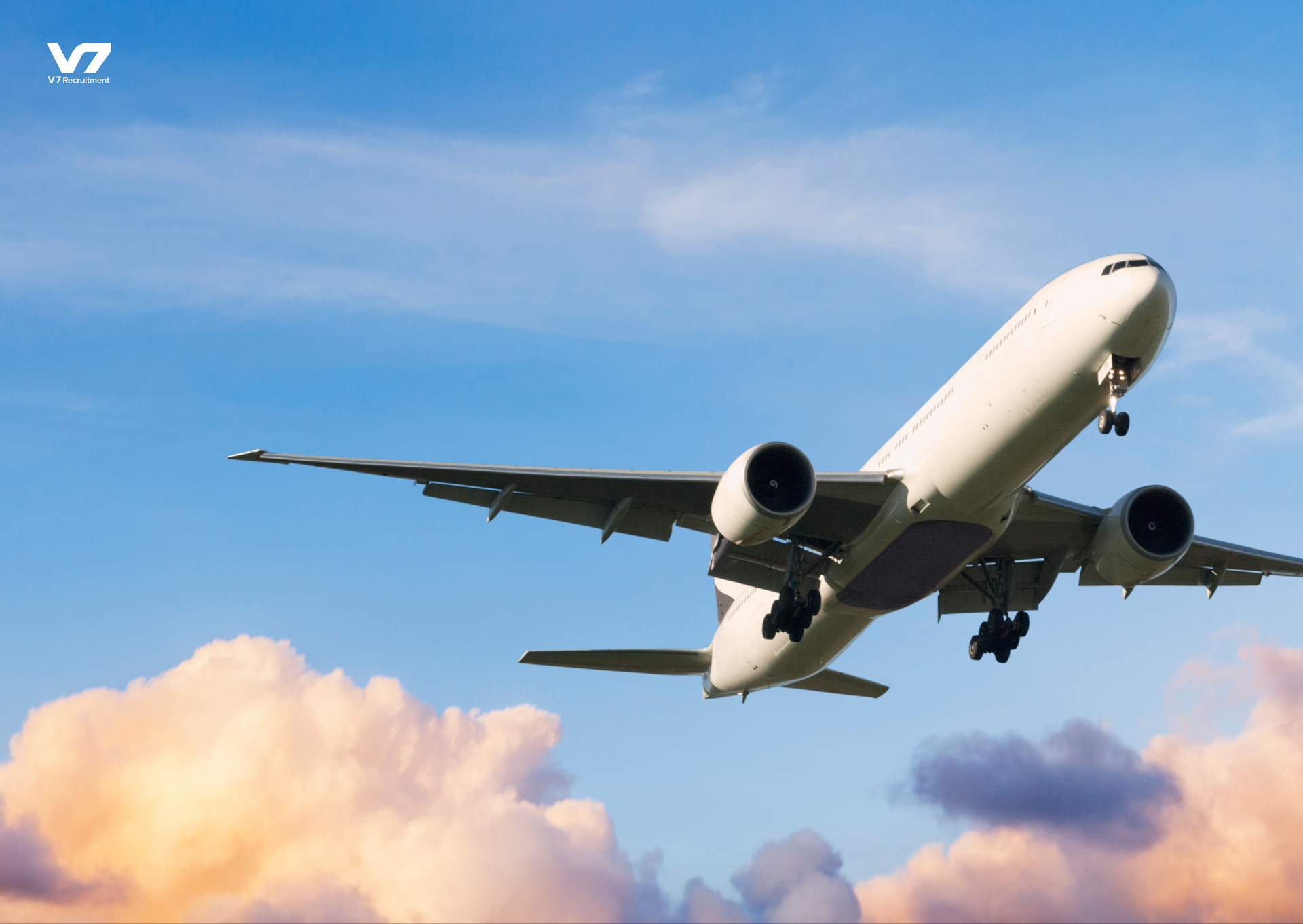 plane taking off with blue sky behind