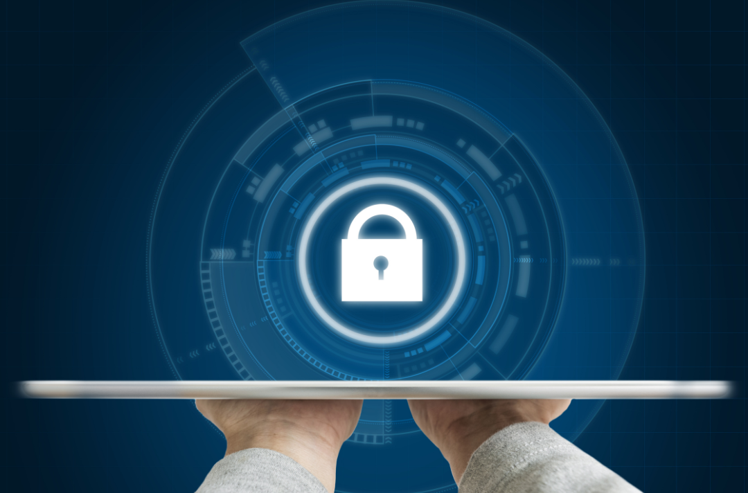 Hands holding tablet with digital lock icon on a blue background.
