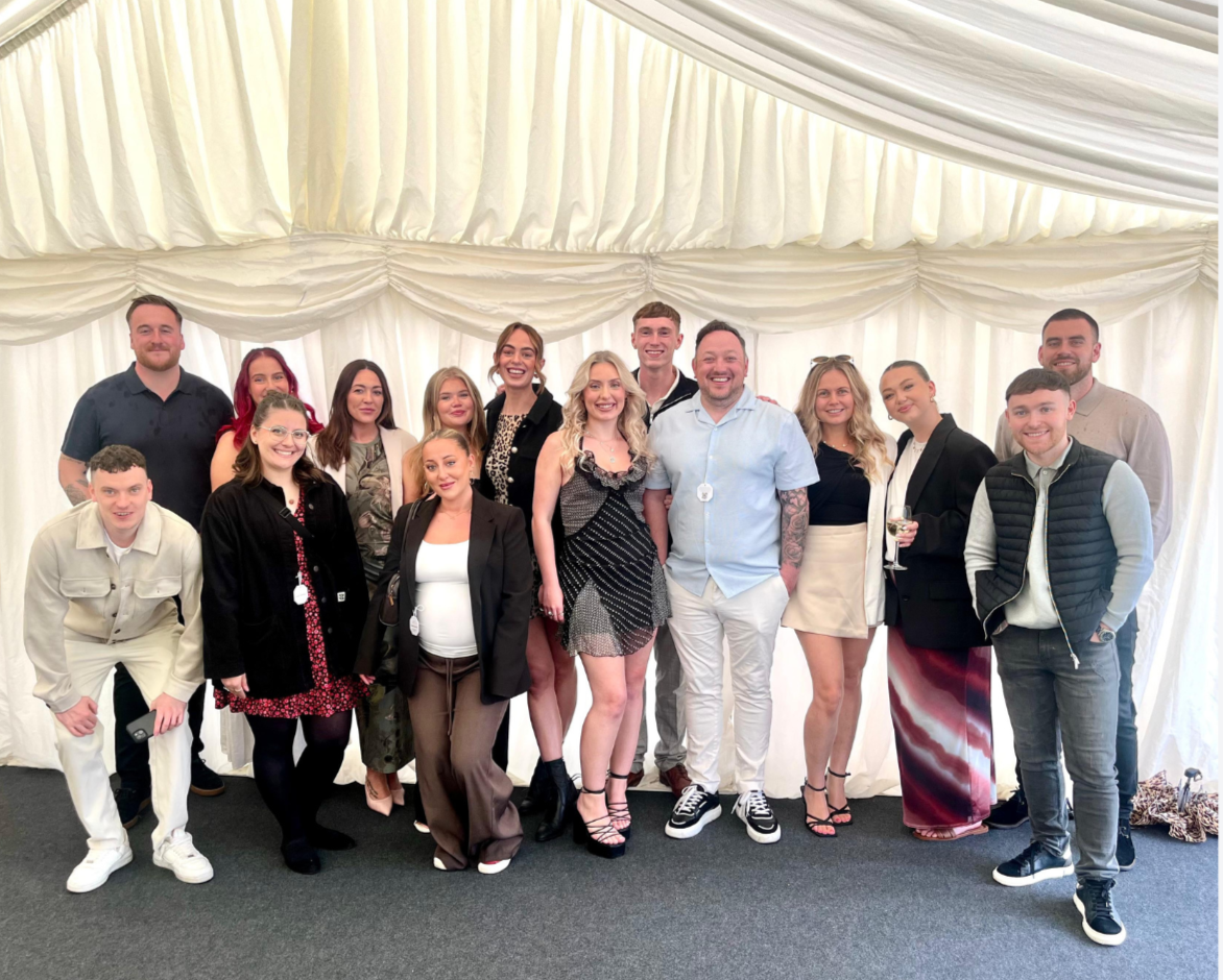 Group picture of V7 Recruitment employees in a marquee