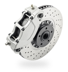 Silver car brake caliper clamping a drilled brake rotor on a white background | Tire Town Inc.