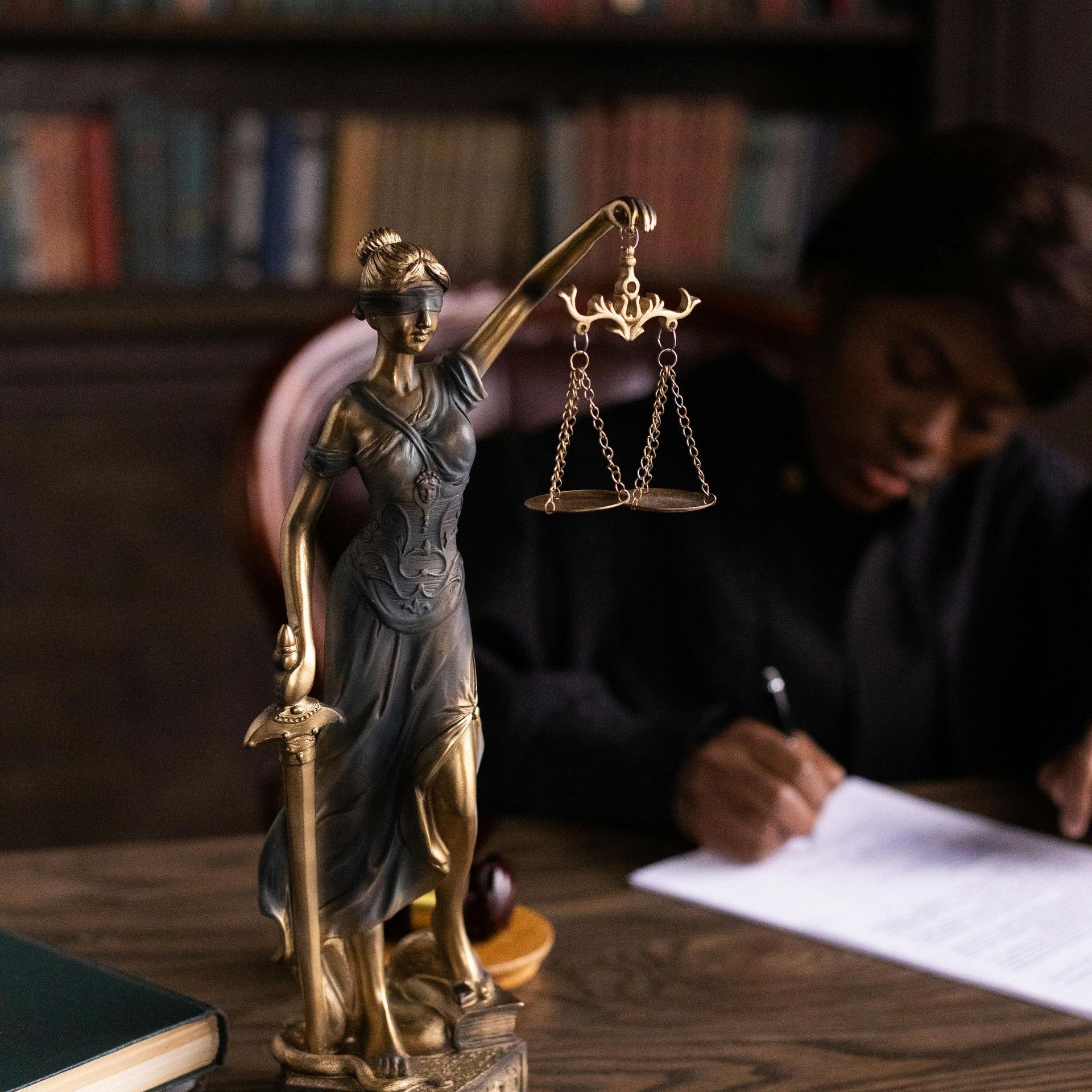 A statue of lady justice holding scales of justice