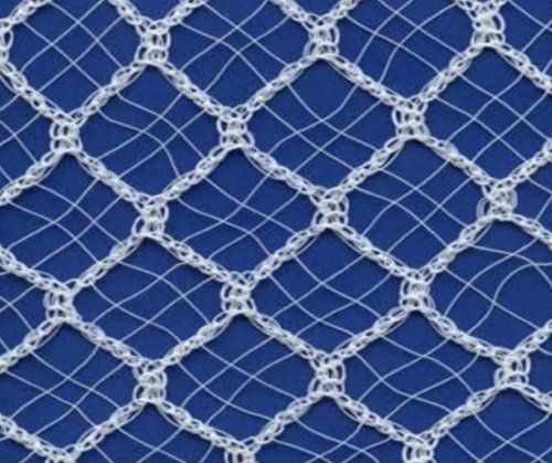 White rope netting against a blue background, forming a diamond pattern