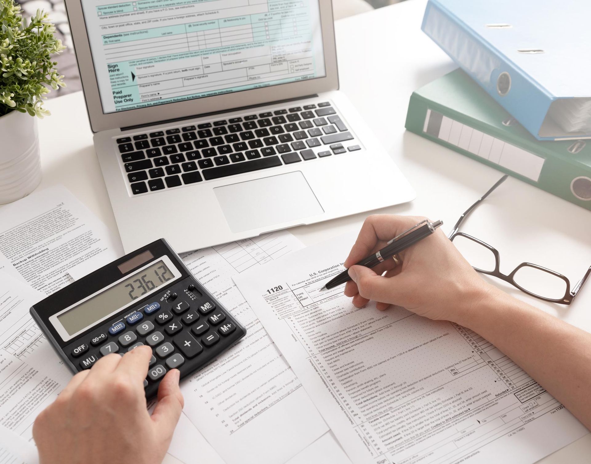 Writing On Tax Form — Clayton, NC — Triangle Small Business Solutions