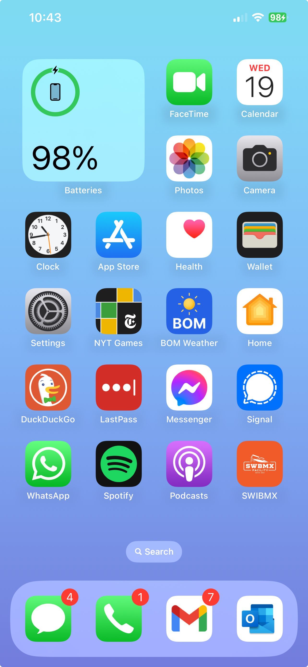 Smartphone home screen with app icons. Battery widget displays 98%. Bottom shows phone, messages, email, and work icons.