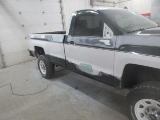 Black Truck With Strip Of White | Faribault, MN | Midwest Collision