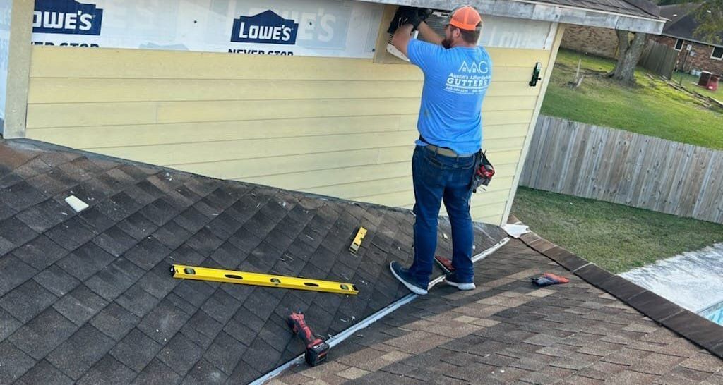 Vinyl siding is being installed on an exterior wall of a house.