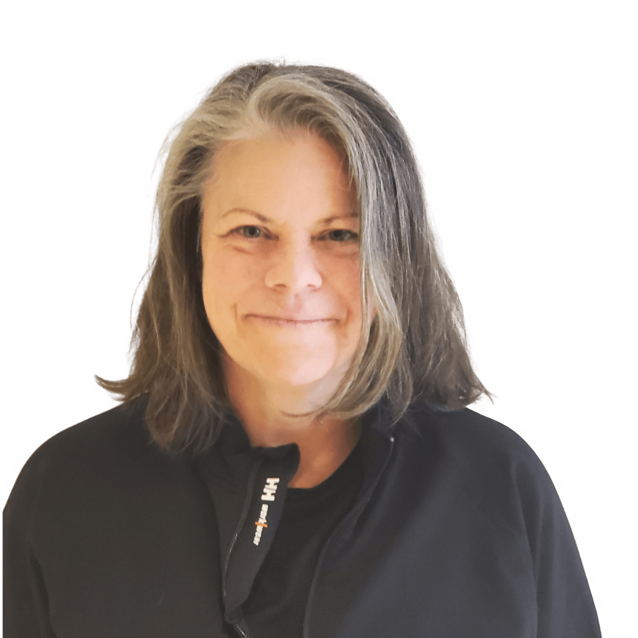 Smiling person with shoulder-length gray hair wearing a black shirt against a white background