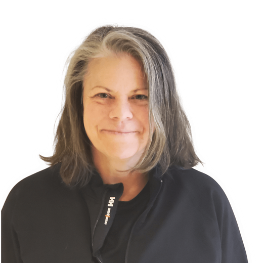 Smiling woman with gray hair wearing a black top on a white background
