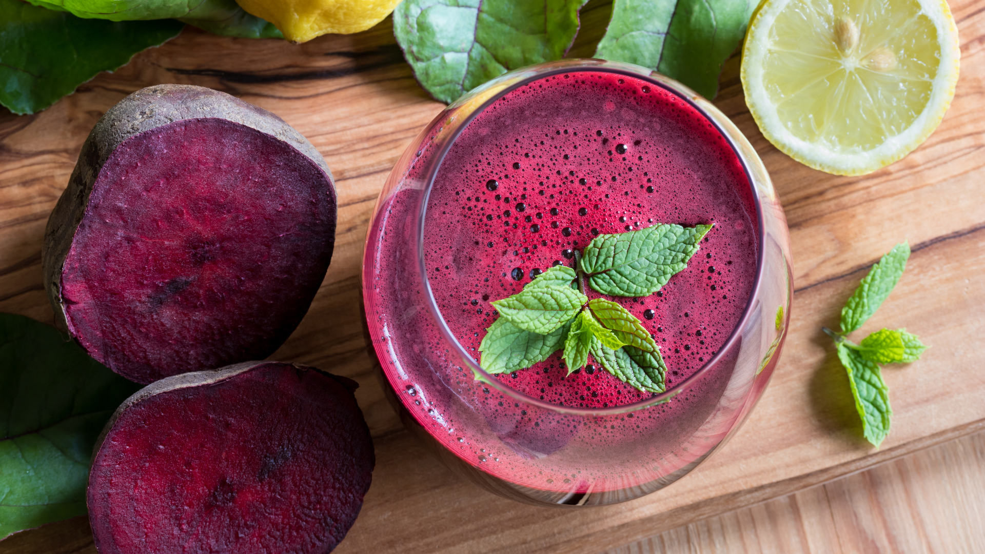 An aerial view of a glass of a pink-coloured mocktail