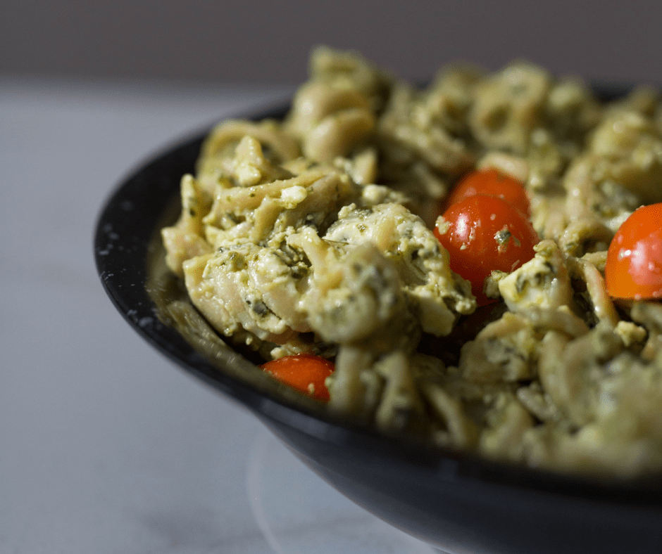 Pesto pasta sitting in a bowl