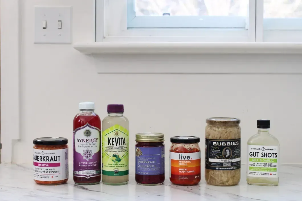 Several fermented food products displayed on a counter