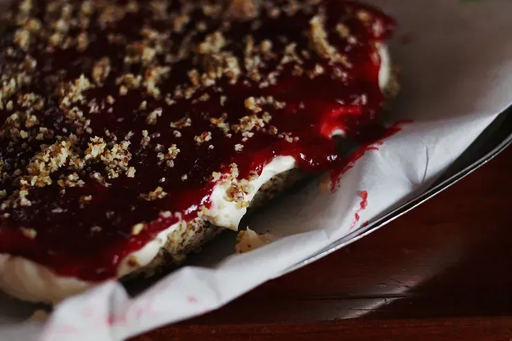 A holiday treat sitting on parchment paper on a pan