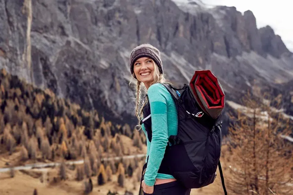 woman in fall lansdcape smiling