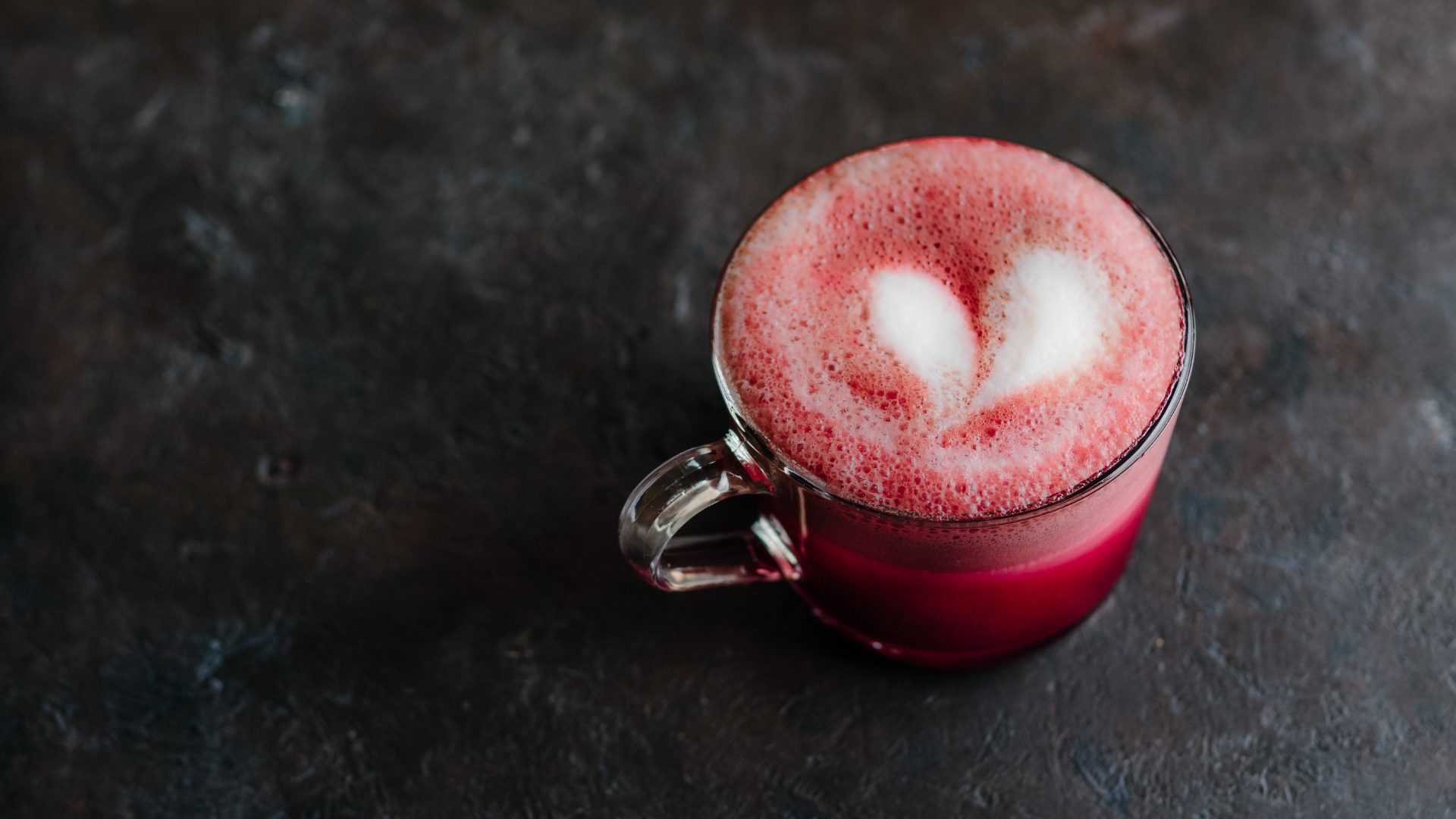 A mug of hot chocolate that has been colored red.