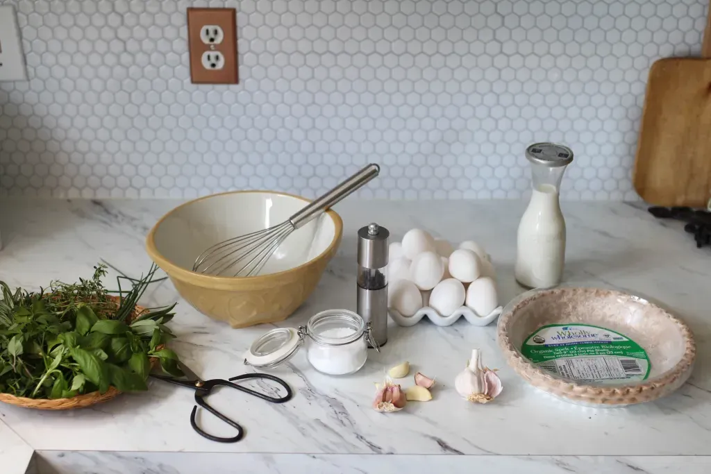 herb quiche ingredients on a counter