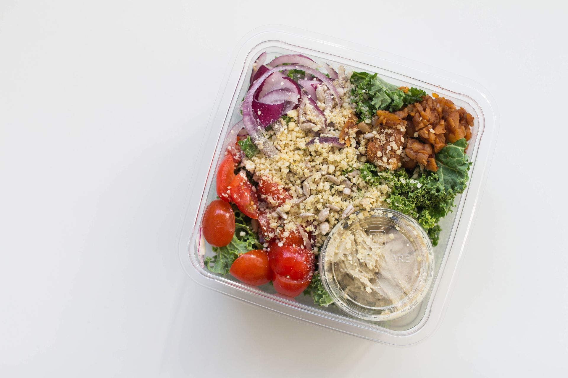 An aerial view of a box of Mighty Caesar Salad