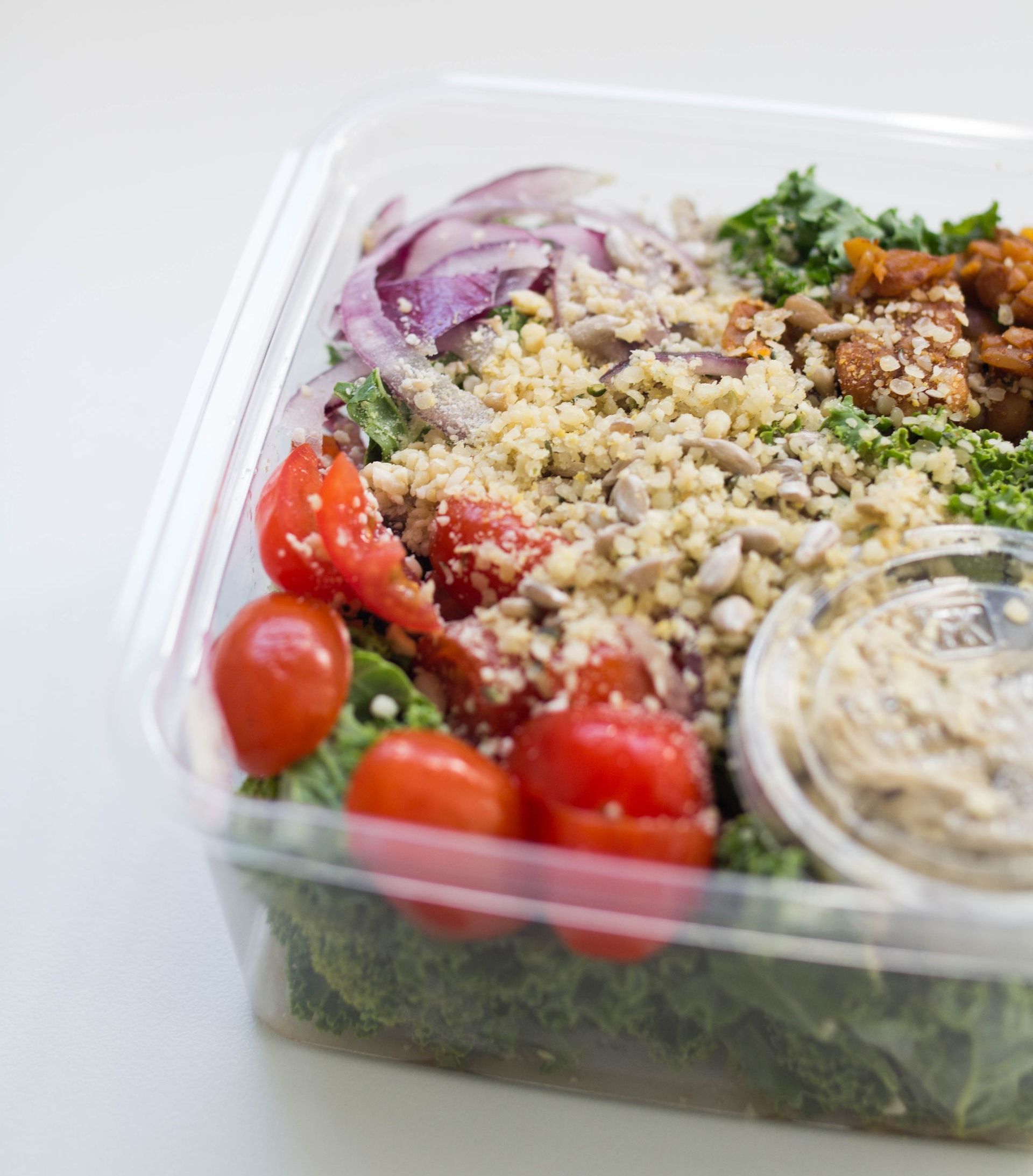 An close-up look of a box of Mighty Caesar Salad