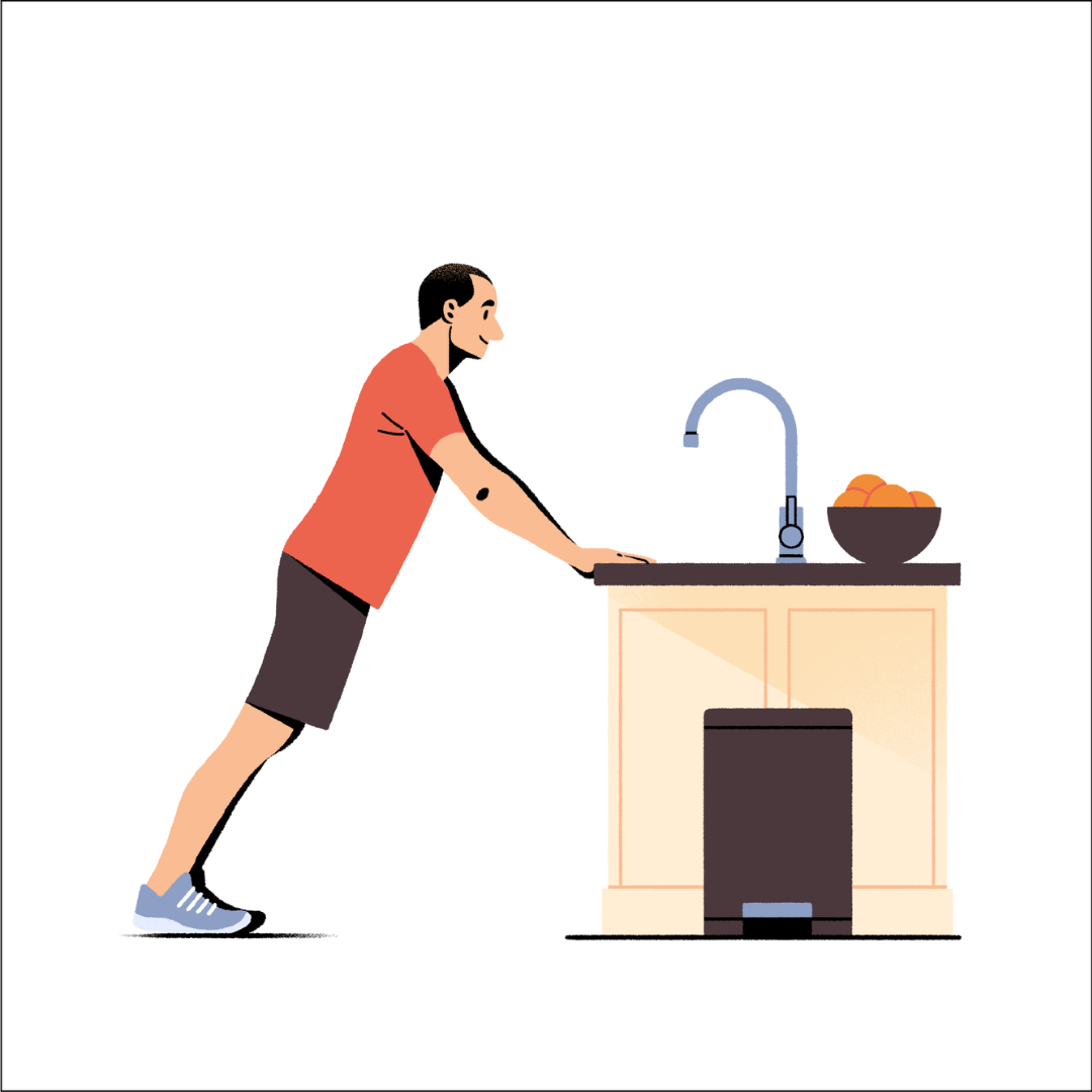 man leaning against kitchen sink