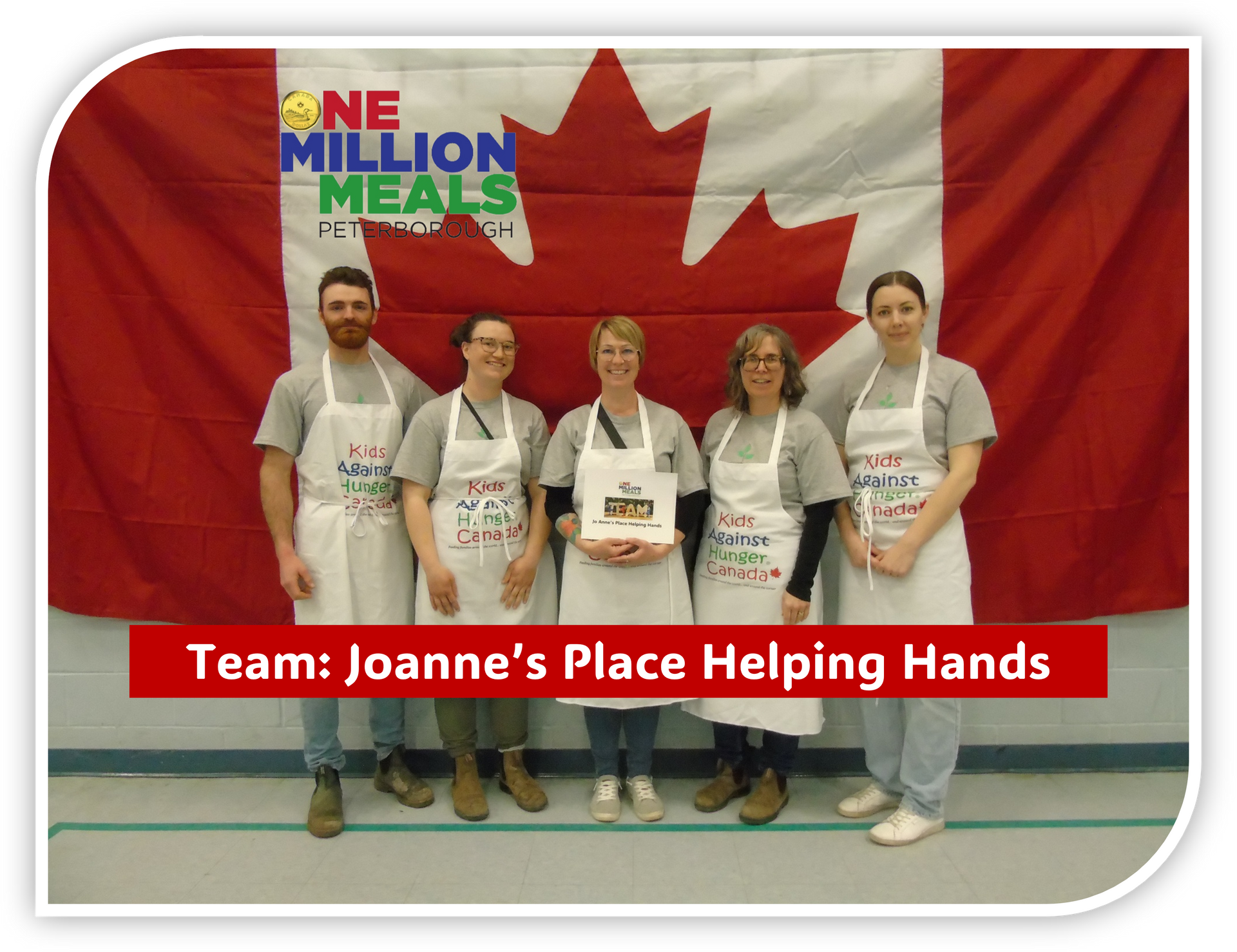 Jo Anne's Place Team standing in aprons in front of a Canadian Flag with the text: 