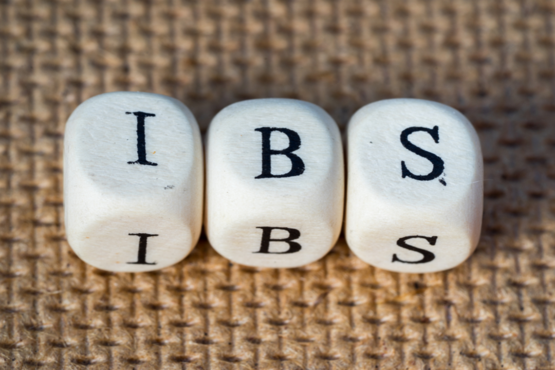 Three white cubes that spell out the word: